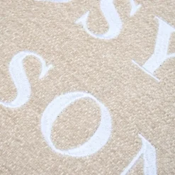 Coussin décoratif avec message brodé