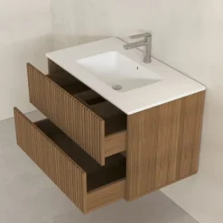 Meuble de salle de bain suspendu avec façade crantée et vasque encastrée