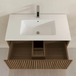 Meuble de salle de bain suspendu avec façade crantée et vasque encastrée