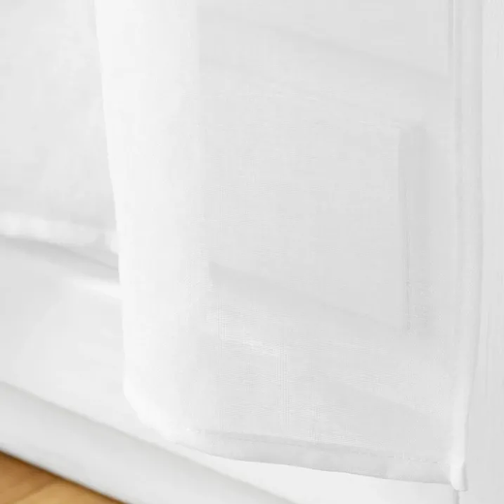 Paire de voilages passe-tringle en voile sablé avec finitions pompons