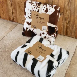 Plaid doux à motif peau de vache avec dos en velours