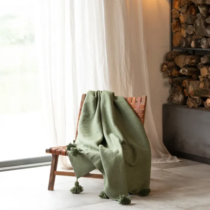 Plaid ou jeté de lit laine à pompons