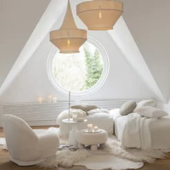 Pouf rond en tissu bouclé