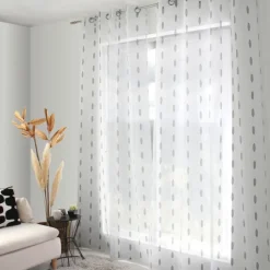 Voilage jacquard à pois ovales à oeillets