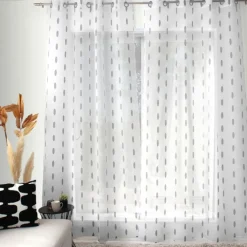 Voilage jacquard à pois ovales à oeillets