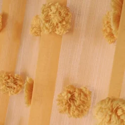 Voilage pompons brodés